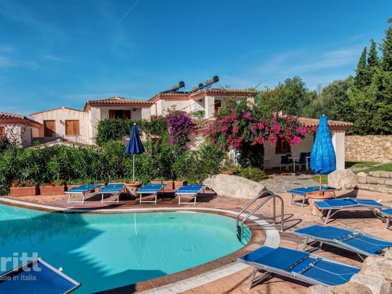 Vacation home with terrace, barbeque & yard in Budoni