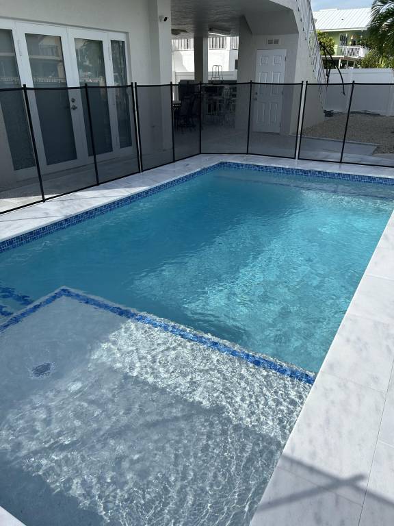 Beautiful Canal front Home with Above Ground Pool, Dock and Fish Cleaning Station — photo 3