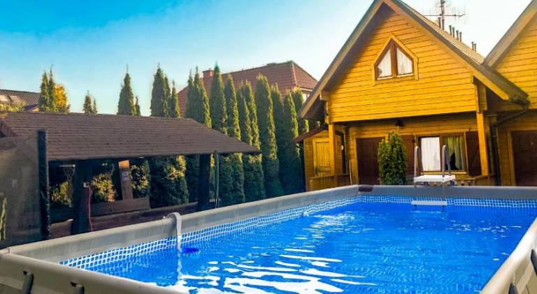 Lodge with barbecue, yard & pool in Mielno