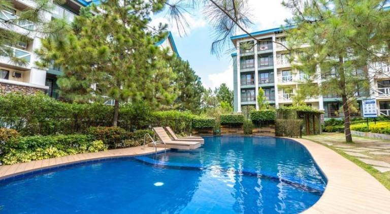 PineSuites Relaxing 2-bedroom condo with pool and garden view accepts small pets only — photo 3