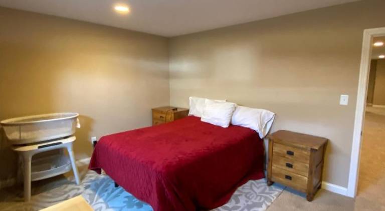 Private basement bedroom with private bathroom, kitchen, and living room with large screen televisio in Fishers, IN