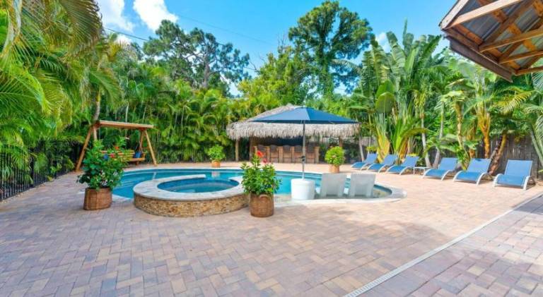 Vacation home with hot tub, pool & sauna | Suitable for remote work in St. Pete Beach, FL