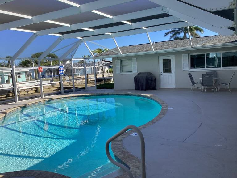 3 Bedroom 1 story home on canal with private pool just steps to Fort Myers beach in Fort Myers Beach, FL