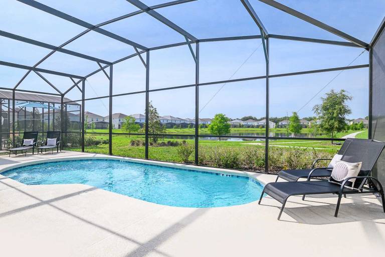 Child-friendly charming vacation home with barbeque, garden & private pool | Lake view | Dogs allowed in Osceola, FL