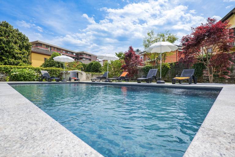 Holiday apartment with pool, garden & grill | Garden view — photo 2