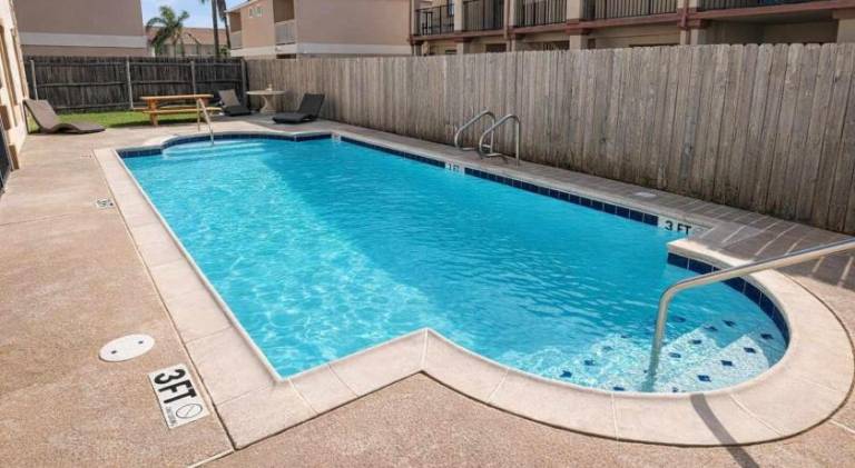 Rental apartment with heated pool & yard in South Padre Island, TX