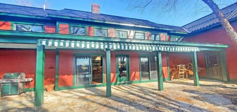The Old Orchard Home surrounded by a small apple orchard, large meadows, and a private pond in Rutland, VT