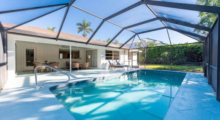 Pesaro - stylish 3BR retreat near Via Miramar Beach, beautifully renovated home with a private pool, in Naples, FL