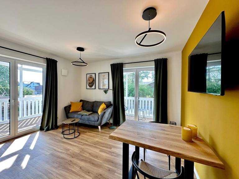 Moderne Ferienwohnung Sun mit überdachtem Balkon und Teilmeerblick in Haffkrug — photo 2