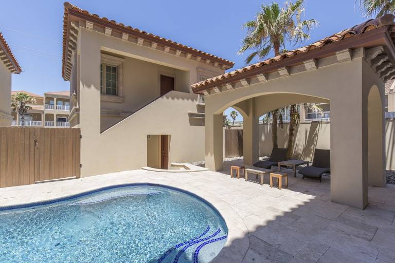 Vacation home with yard & pool in South Padre Island, TX