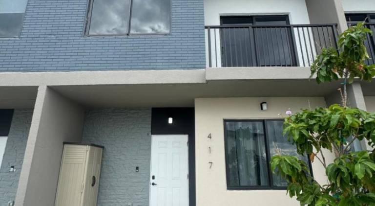 Modern townhome with kitchen and backyard access — photo 5