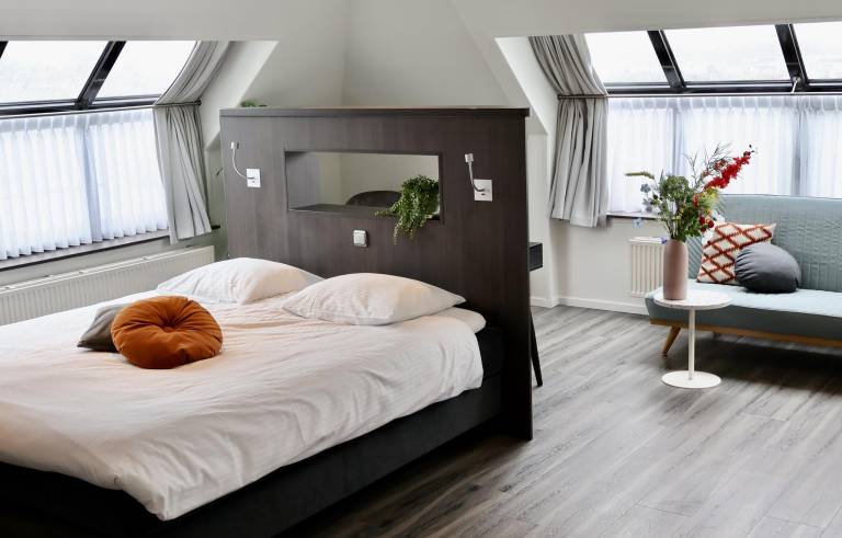 Deluxe hotel room with luxurious amenities a duo whirlpool tub and stunning water views for the ultimate relaxation