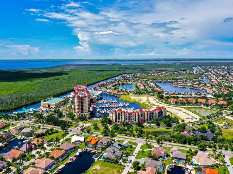 Condo with barbeque & heated pool | Water view — photo 2
