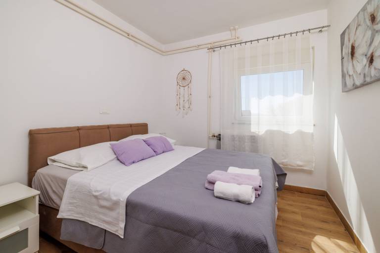 Holiday apartment with terrace, garden & barbeque | Garden view in Rab