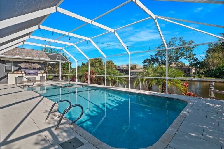 Luxury Heated Pool Home on Saltwater Canal w Tiki — photo 2