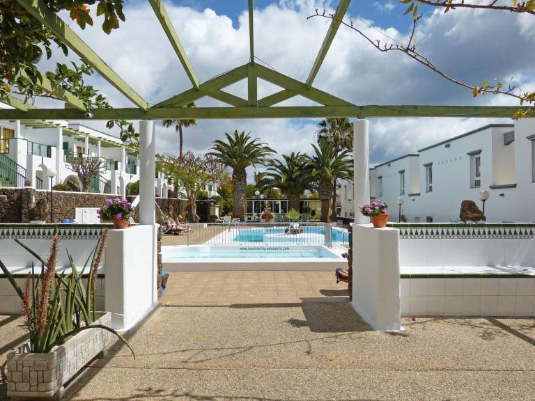 Serviced apartment with patio, pool & garden in Tías