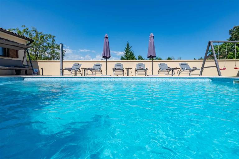 Rental with yard, terrace & BBQ | Pool view — photo 5