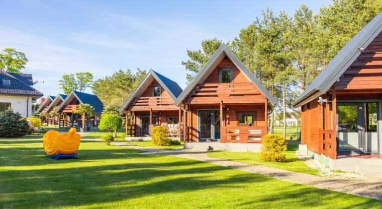 Lodge with barbecue, yard & patio in Mielno