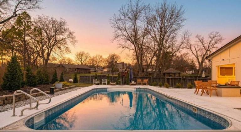 Fully equipped charming vacation home with patio, private pool & yard | Pet-friendly in Kansas City, KS