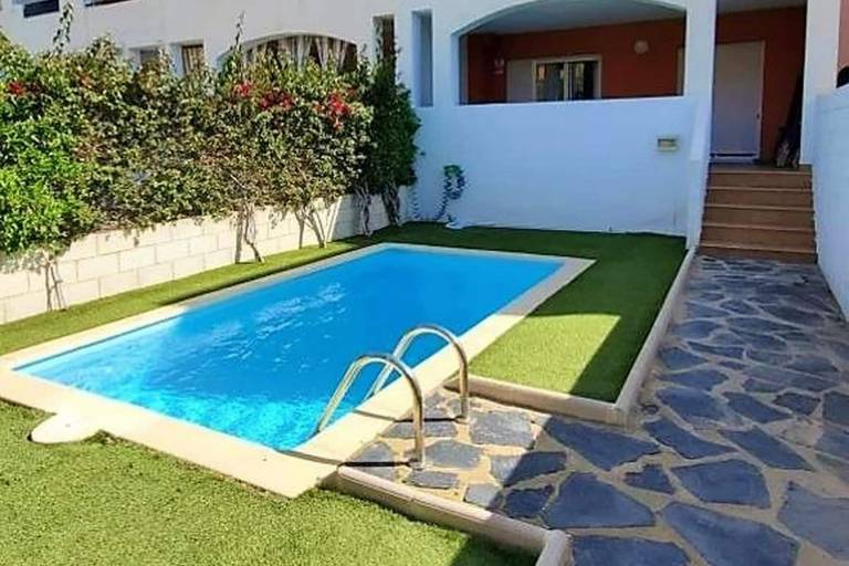 Charming holiday apartment with pool, yard & grill | Sea view | Beach nearby | Pet-friendly in Playas