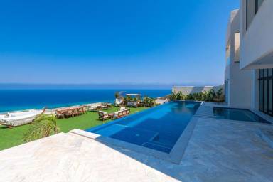 Family-friendly villa with private pool & garden | Sea view