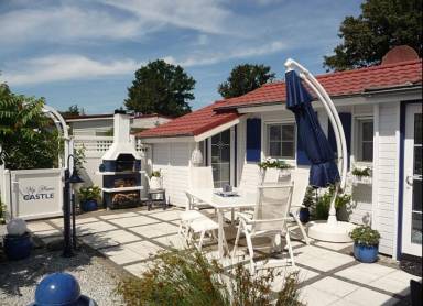 Ferienhaus De Graaf mit einer sonnigen Terrasse und Garten IJsselmeer