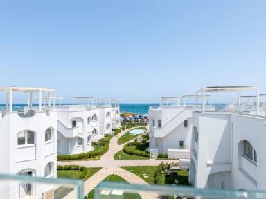 Charmante Wohnung mit Terrasse, Pool und Grill | Meerblick | Neben dem Strand